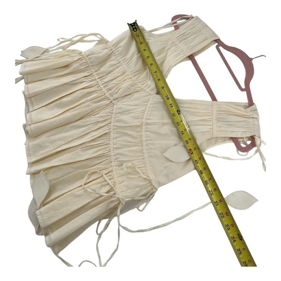 Tory Burch
Sleeveless Smocked Peplum Top COLOR New Ivory size 0 - Picture 12 of 17